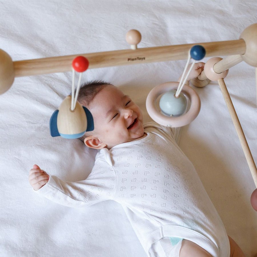 PlanToys Baby Gym (Orchard) – Baby Activity Toy for children, available at Learning Bugs UK