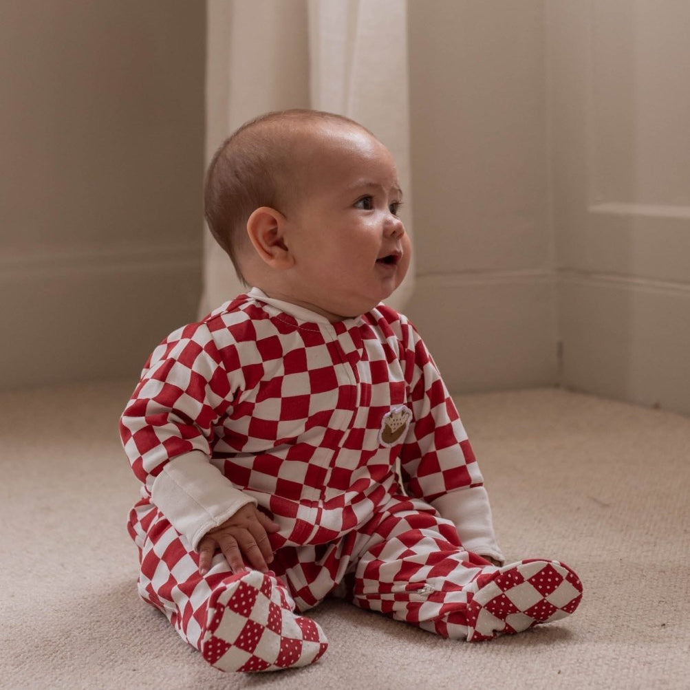 Avery Row Christmas Baby Jersey Sleepsuit - Red Checkerboard – Baby Clothing for children, available at Learning Bugs UK