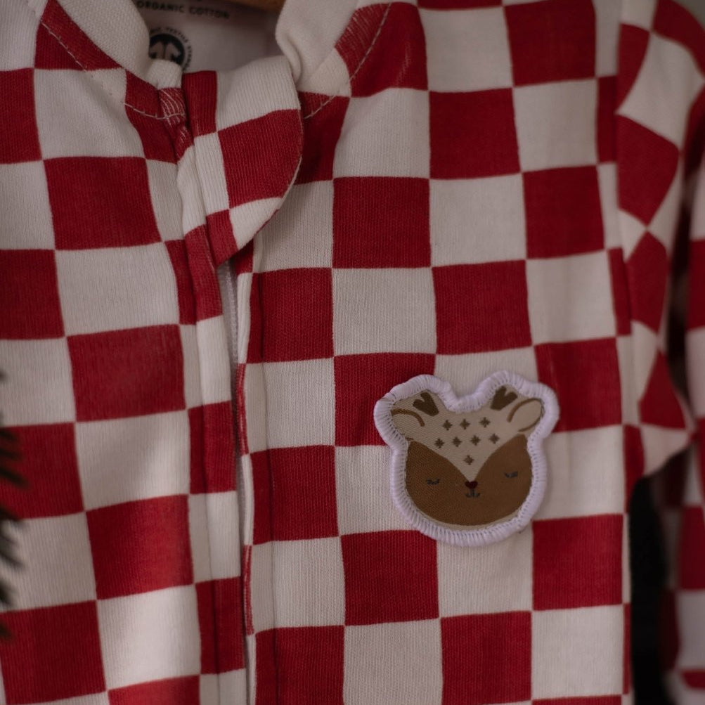Avery Row Christmas Baby Jersey Sleepsuit - Red Checkerboard – Baby Clothing for children, available at Learning Bugs UK