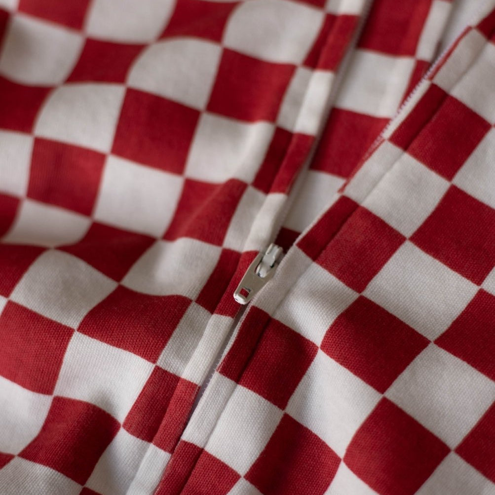 Avery Row Christmas Baby Jersey Sleepsuit - Red Checkerboard – Baby Clothing for children, available at Learning Bugs UK