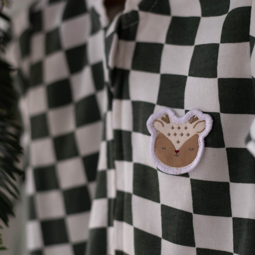 Avery Row Christmas Baby Jersey Sleepsuit - Green Checkerboard – Baby Clothing for children, available at Learning Bugs UK