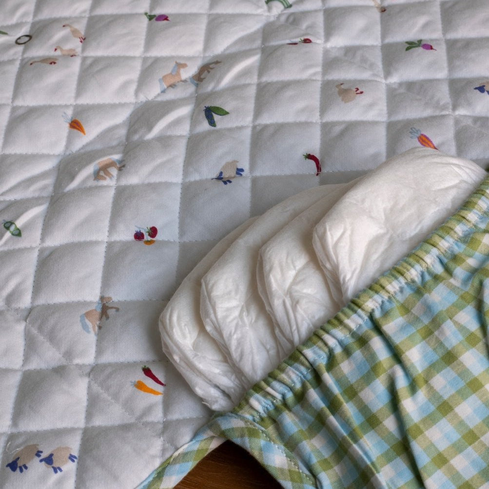 Cotton Travel Baby Changing Mat - Greenhouse Gingham – Changing Bags & Travel Changing Mats for children, available at Learning Bugs UK