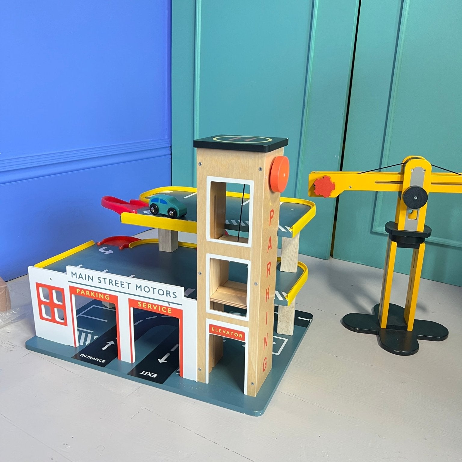 Buy Multi Level Garage with Lift | Wooden garage playset + cars for kids by Learning Bugs UK