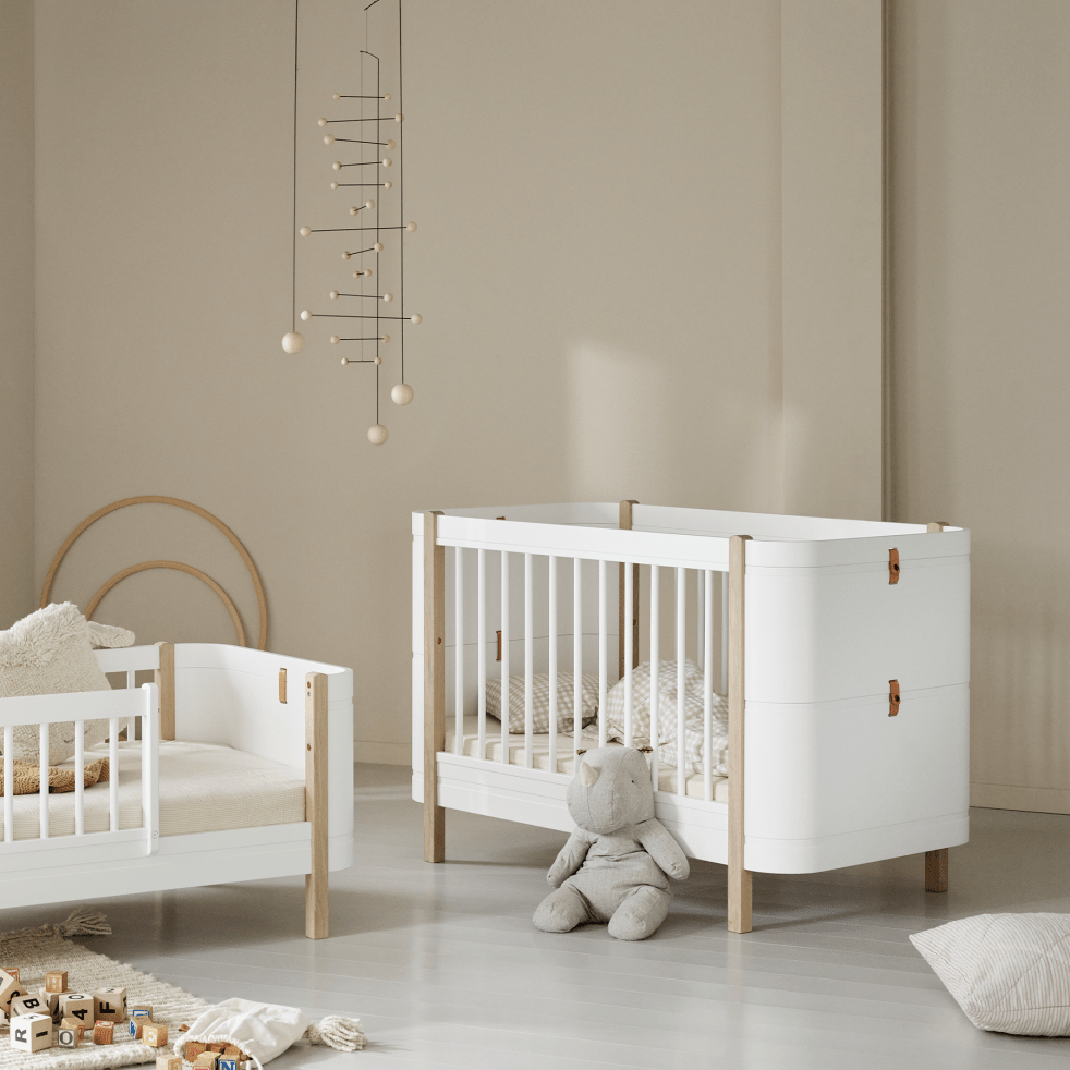 Mini+ Cot Bed Incl. Junior Kit - White/Oak (0-9 Years) – Cot Beds for children, available at Learning Bugs UK