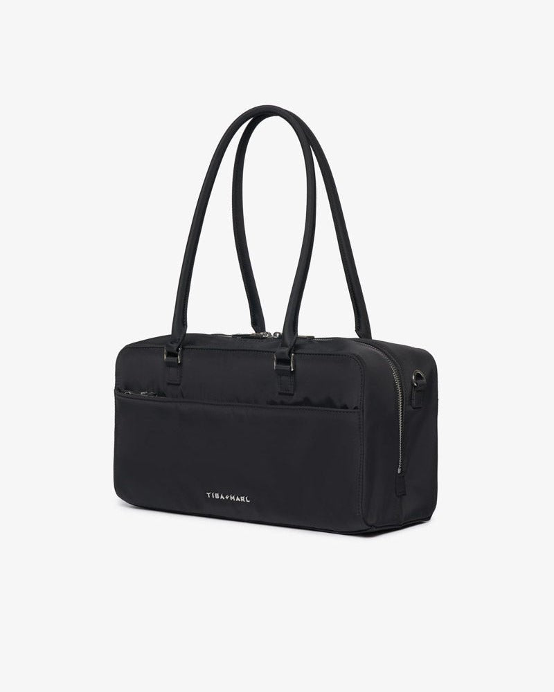Riley Compact East-West Changing Bag Black Woven – Compact Changing Bag for children, available at Learning Bugs UK