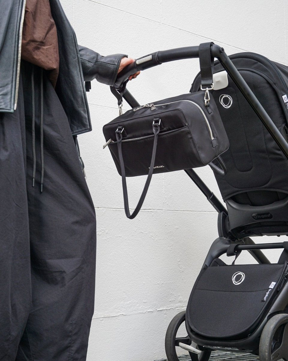 Riley Compact East-West Changing Bag Black Woven – Compact Changing Bag for children, available at Learning Bugs UK