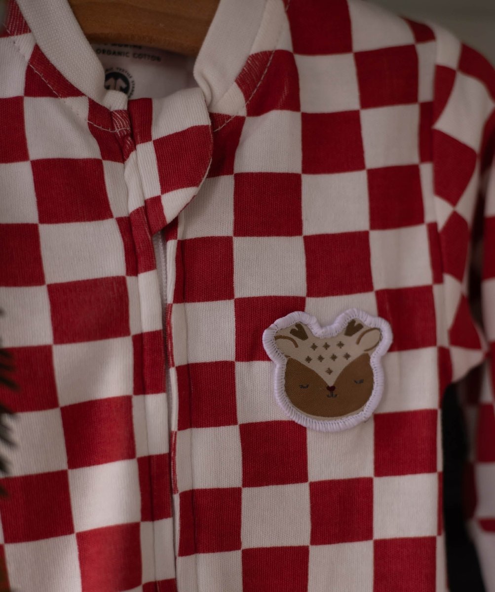 Avery Row Christmas Baby Jersey Sleepsuit - Red Checkerboard – Baby Clothing for children, available at Learning Bugs UK
