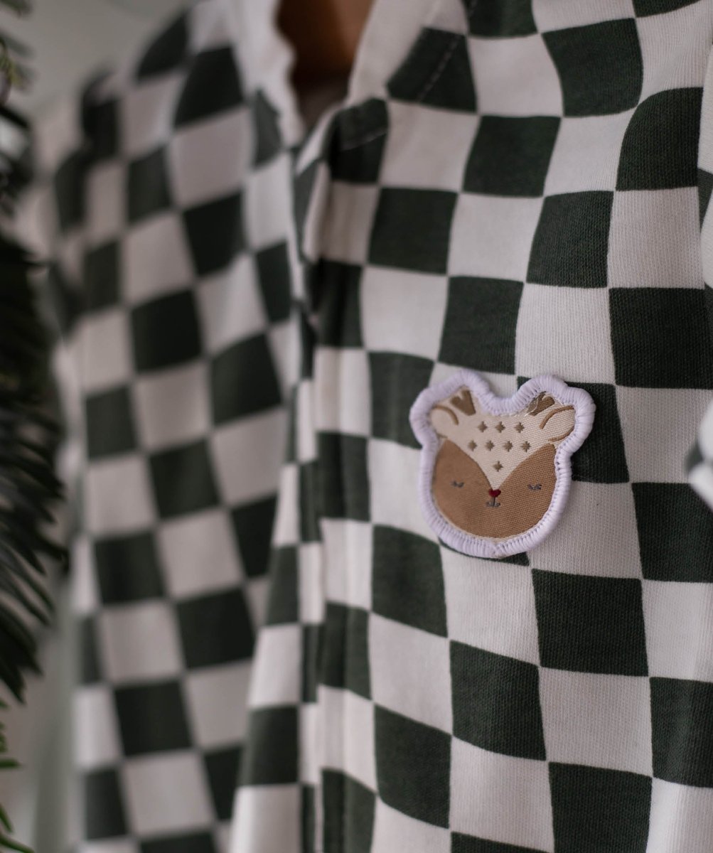 Avery Row Christmas Baby Jersey Sleepsuit - Green Checkerboard – Baby Clothing for children, available at Learning Bugs UK