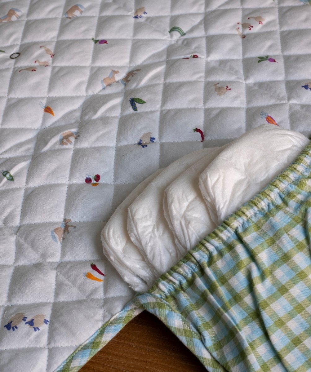 Cotton Travel Baby Changing Mat - Greenhouse Gingham – Changing Bags & Travel Changing Mats for children, available at Learning Bugs UK