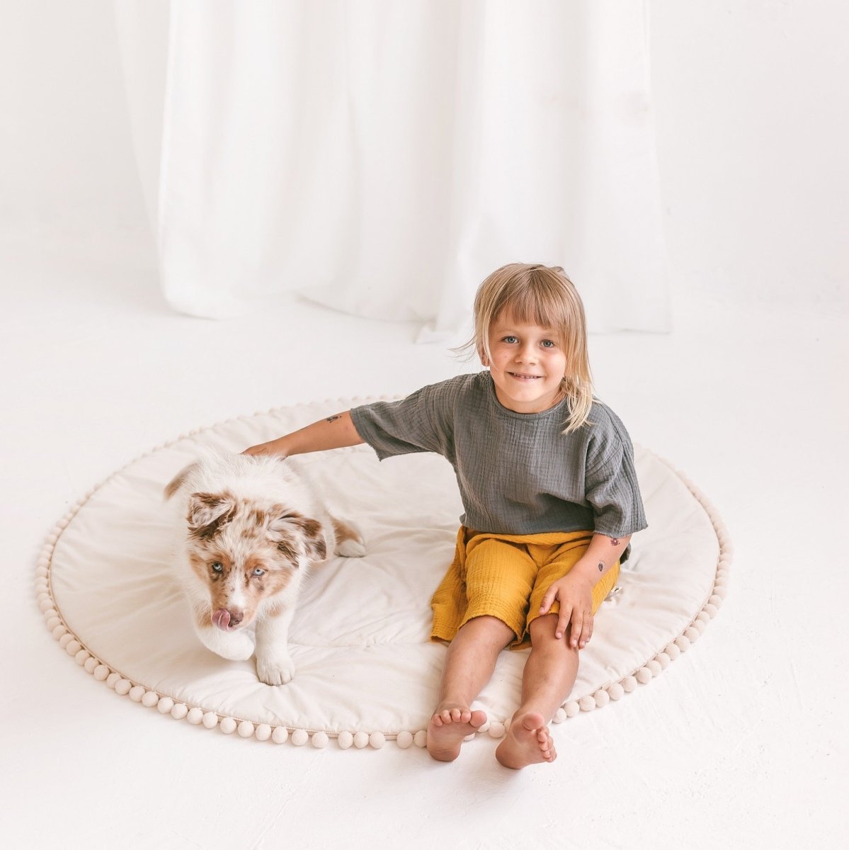MINICAMP Kids Playmat with Pompom Border in Ecru – Playmats for children, available at Learning Bugs UK