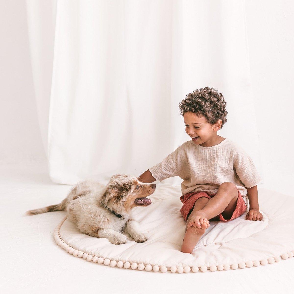MINICAMP Kids Playmat with Pompom Border in Ecru – Playmats for children, available at Learning Bugs UK