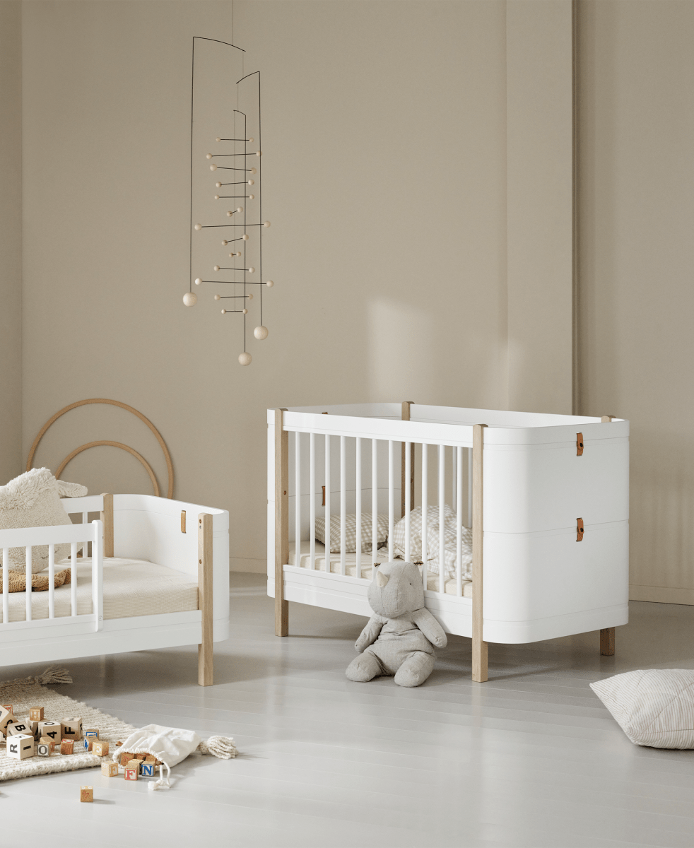 Mini+ Cot Bed Incl. Junior Kit - White/Oak (0-9 Years) – Cot Beds for children, available at Learning Bugs UK