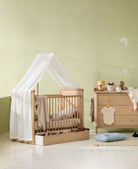 Oliver Furniture Camp Novel cot bed with canopy holder and transparent white canopy, available at Learning Bugs UK