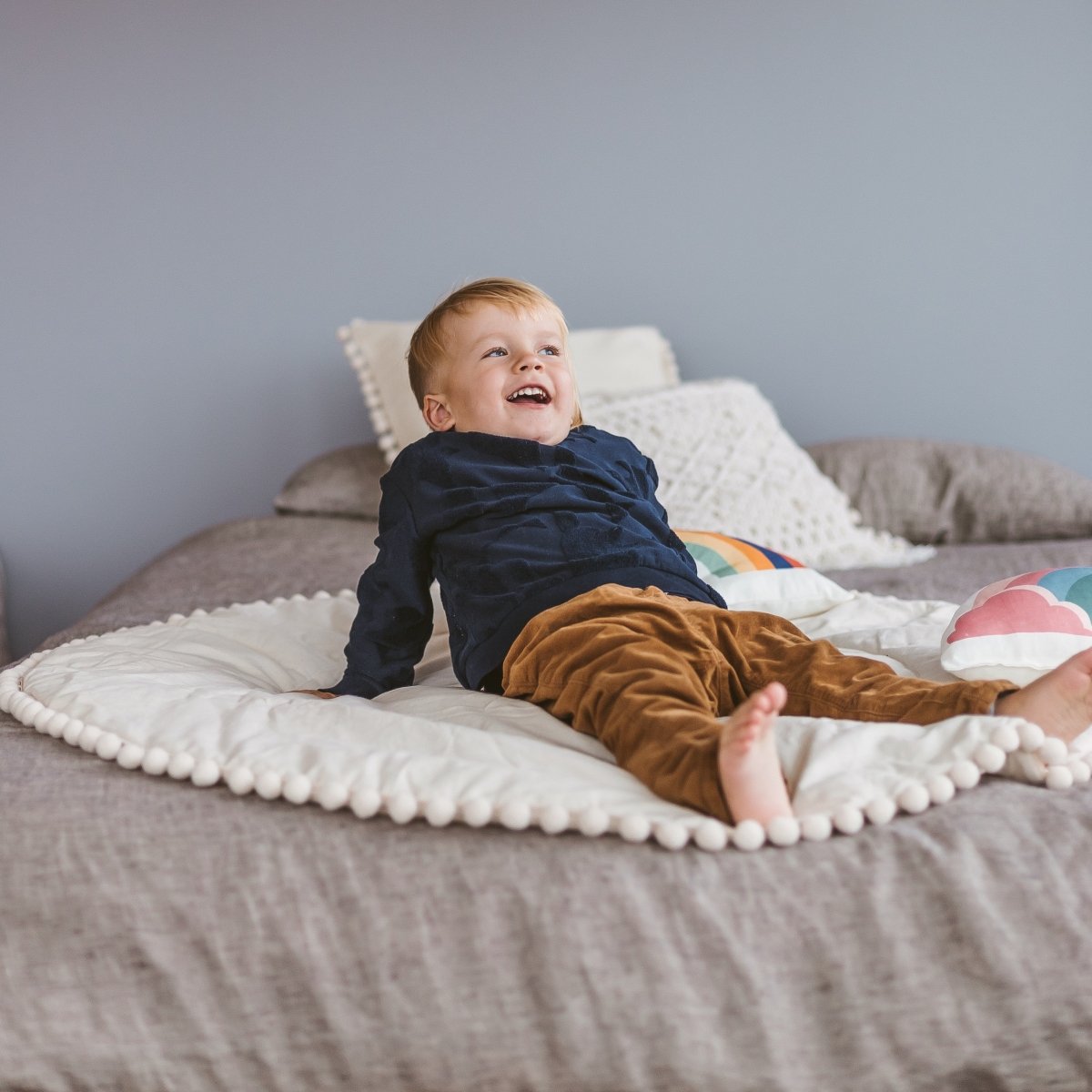 MINICAMP Kids Playmat with Pompom Border in Ecru – Playmats for children, available at Learning Bugs UK
