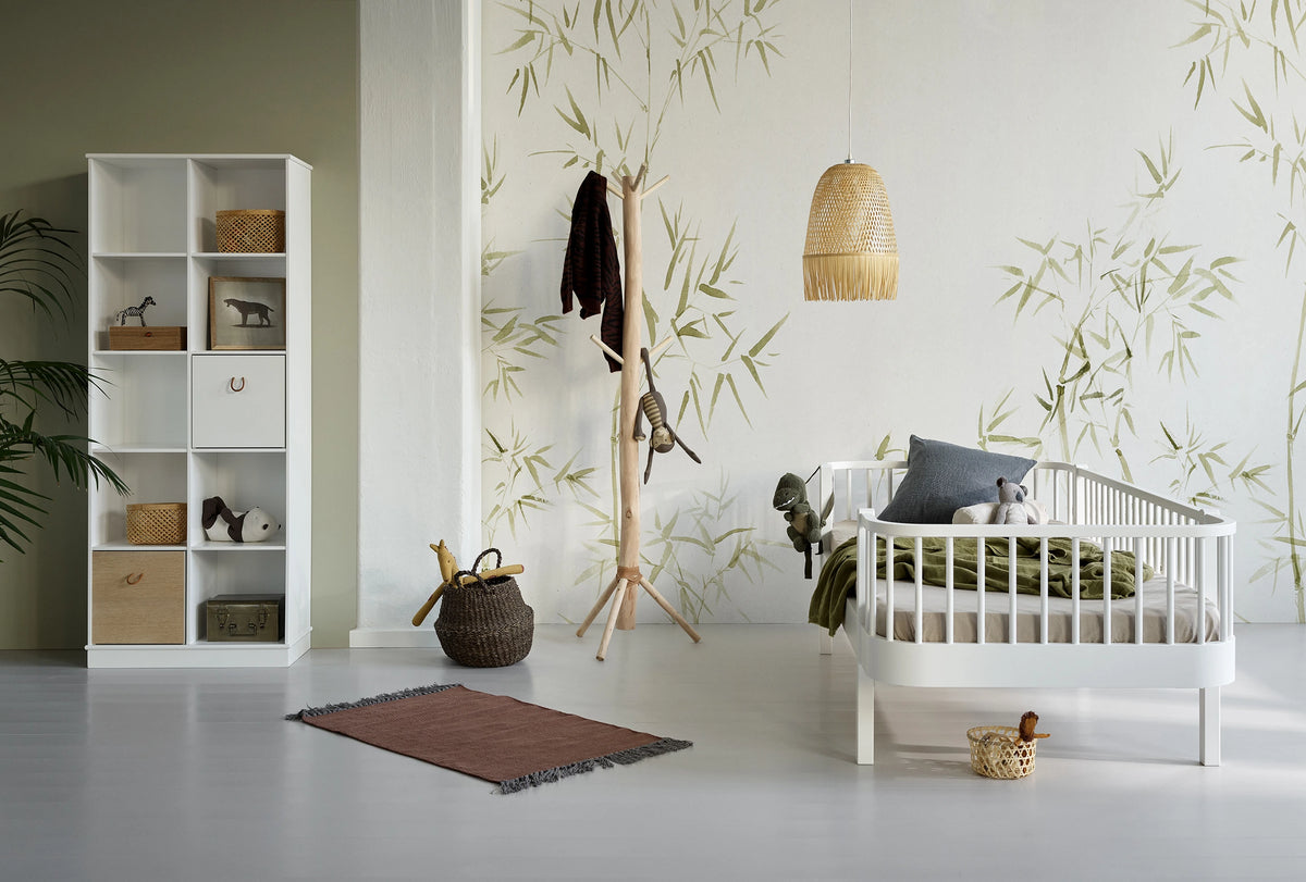 An Oliver Furniture cot in a calm nursery
