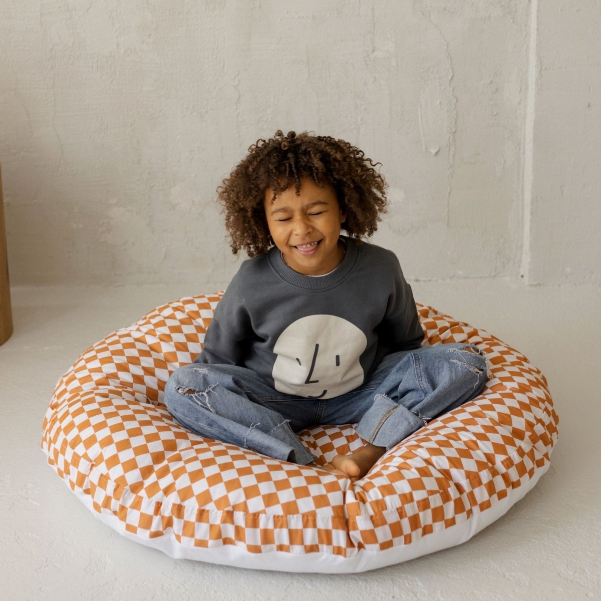 MINICAMP Checkered Large Kids Floor Cushion in Off-white and Orange – Floor Pillows for children, available at Learning Bugs UK