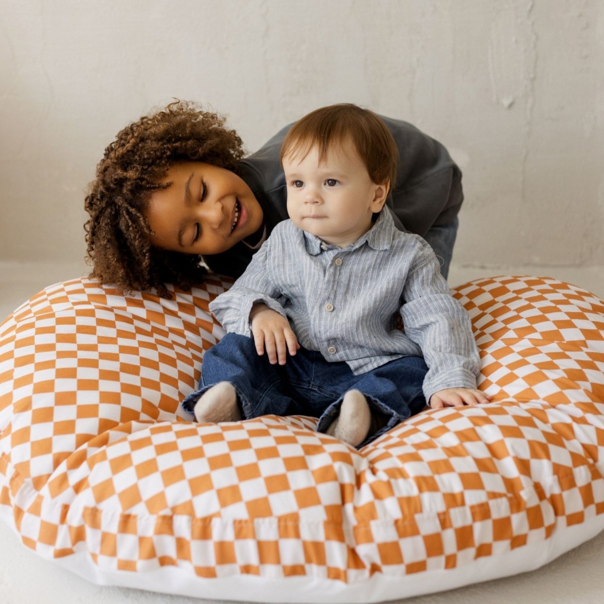 MINICAMP Checkered Large Kids Floor Cushion in Off-white and Orange – Floor Pillows for children, available at Learning Bugs UK