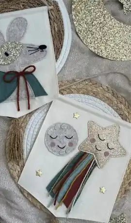 Handmade felt decorations laid out on a table