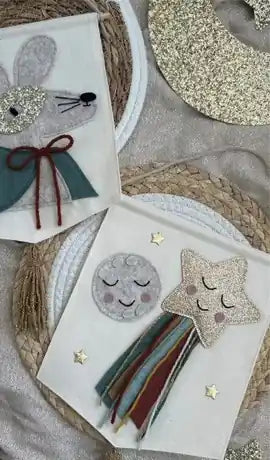 Handmade felt decorations laid out on a table